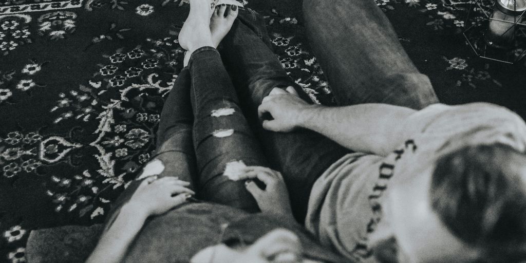 grayscale photo of woman and man