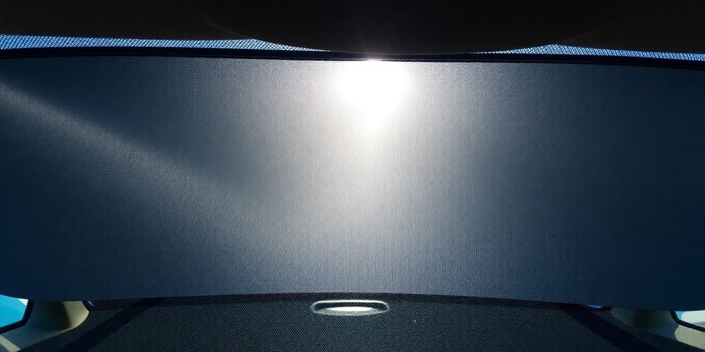 Car windshield with sunshade deployed.