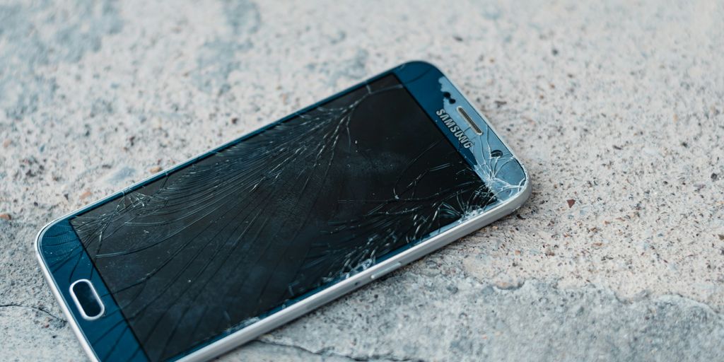 blue samsung android smartphone on gray marble table