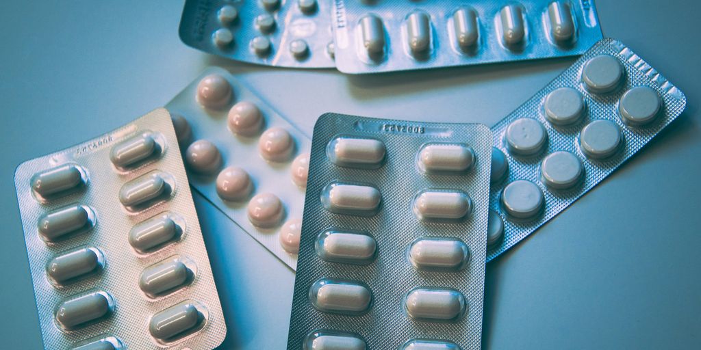 white and blue medication pill blister pack