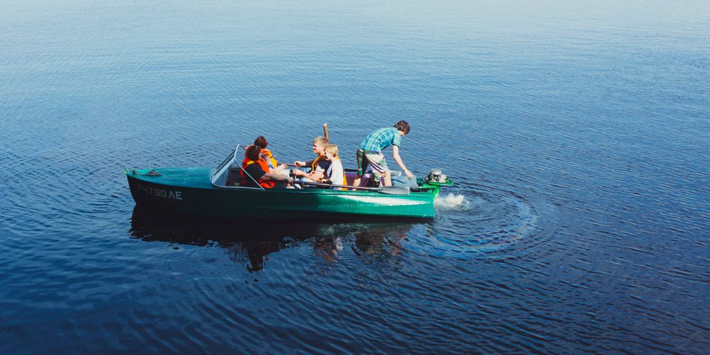 people riding power boat