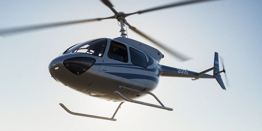 A Bell 206 Jet Ranger helicopter flying against a sky.