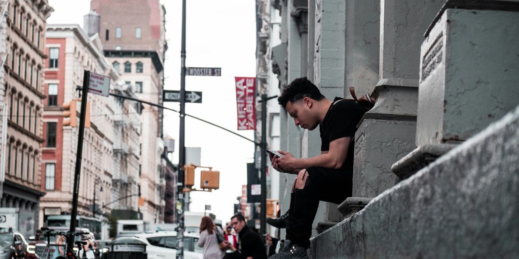 man taking selfie on road