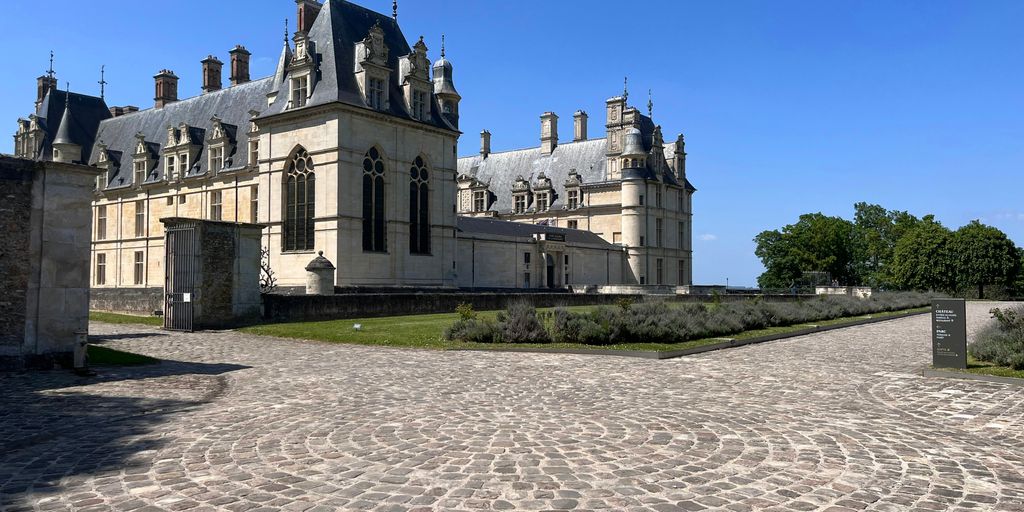 a large stone building with a clock tower on top of it