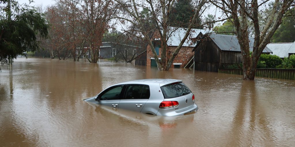 a car driving through a flooded street