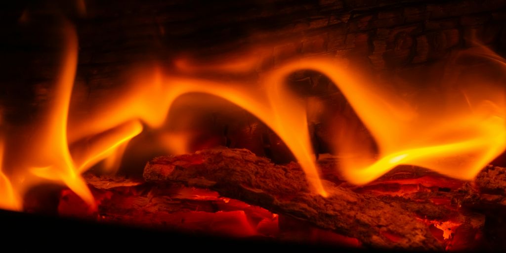 A close up of a fire burning in a fireplace
