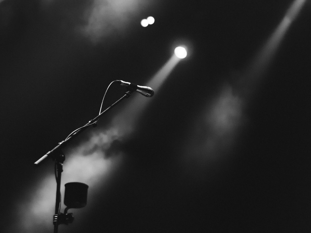 photo of microphone on foggy stage
