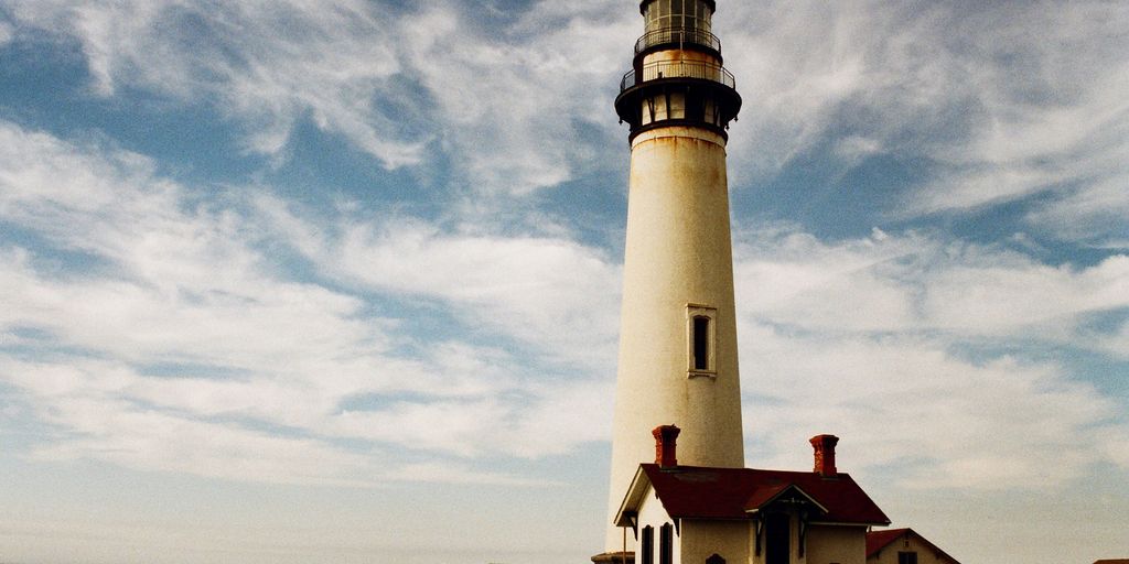 lighthouse near body of water