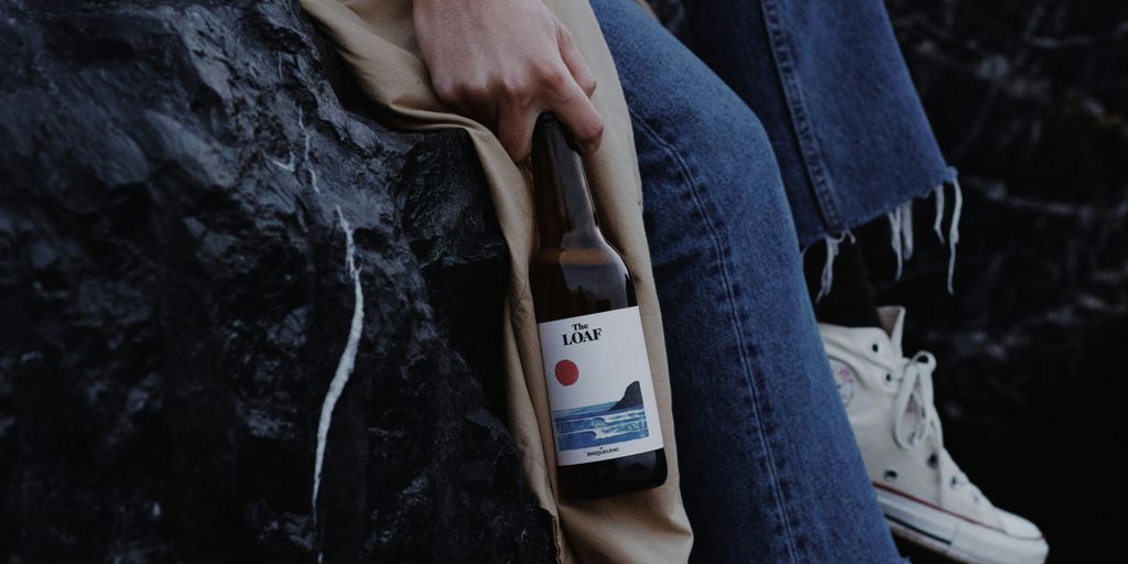 person holding white labeled bottle