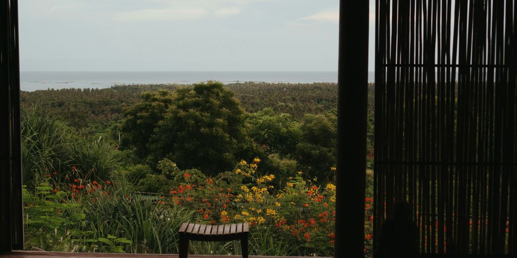 a wooden bench sitting on top of a wooden floor