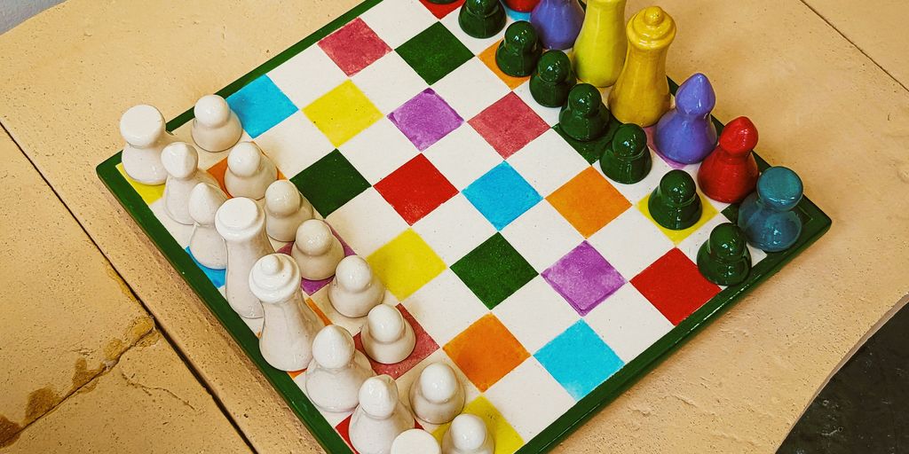 A cake shaped like a chess board on a table