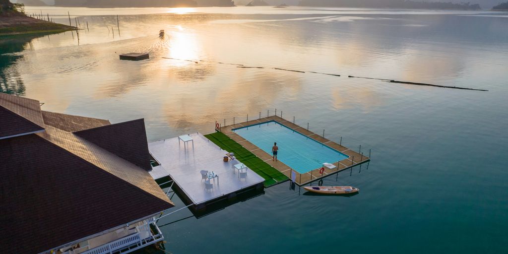 A body of water with a dock in the middle of it