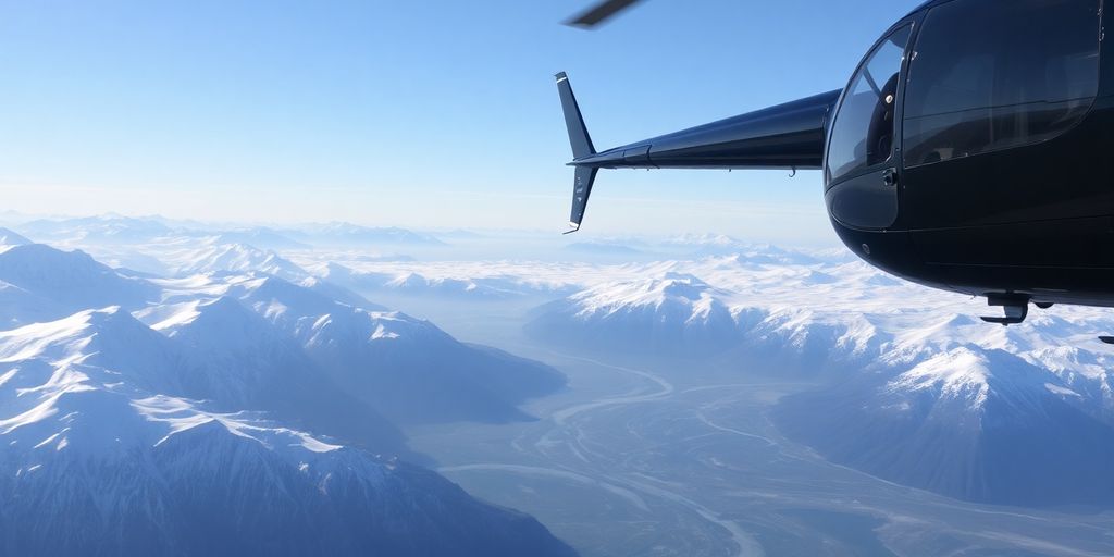 A helicopter flies over massive Alaskan mountains and glaciers.