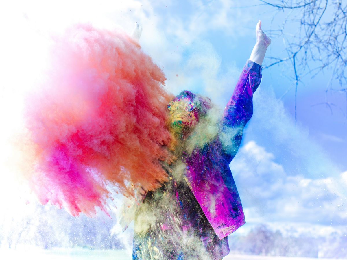 person covered by holi powder