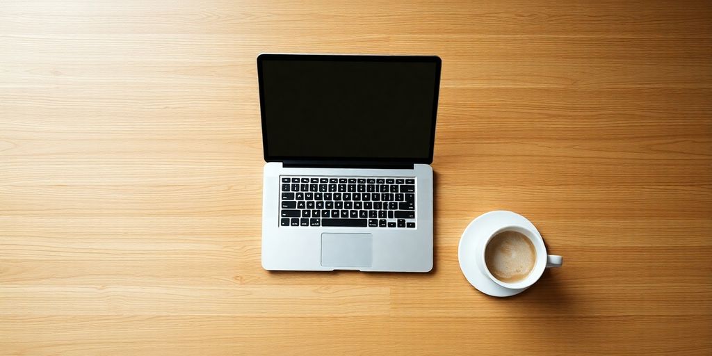 Table with a laptop and coffee.