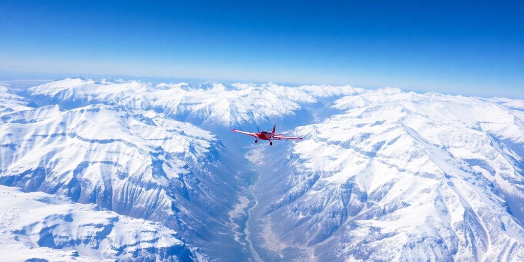 An airplane flies over a vast, snowy Alaskan mountain range.