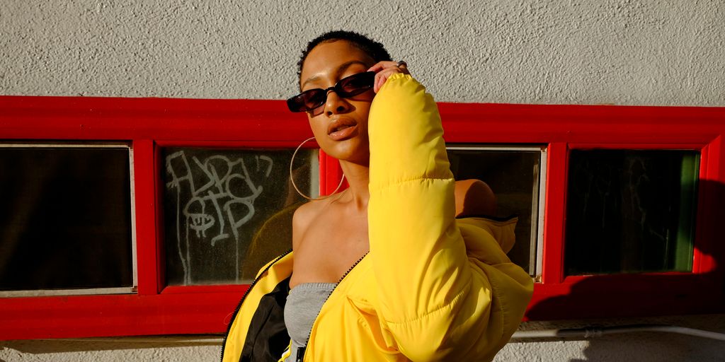 woman holding her sunglasses