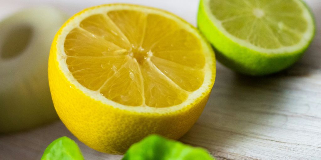 a cut up lemon sitting on top of a wooden table