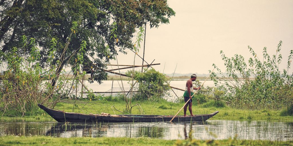 man standing on boat