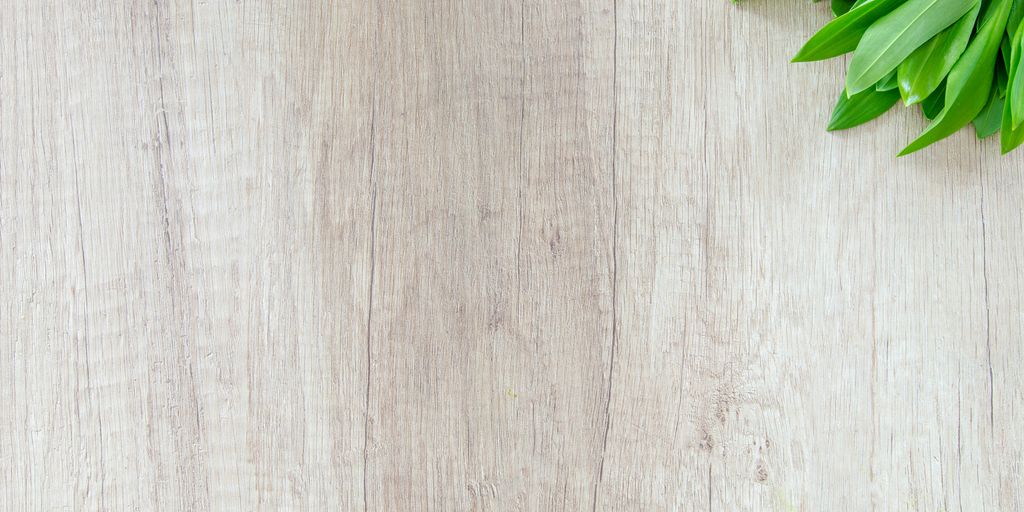 green leafed vegetable on brown wooden surface