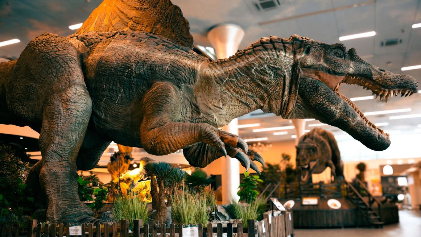 Dinosaurs displayed in a museum-like setting with realistic features.