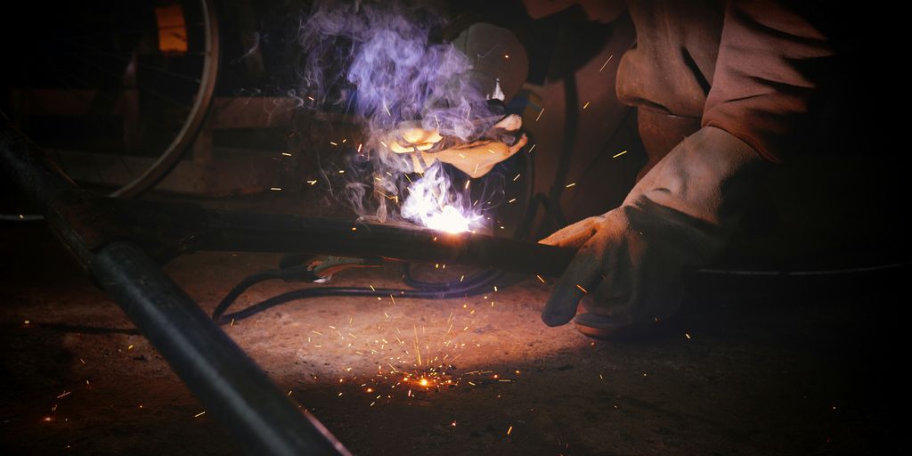 a person working on a piece of metal