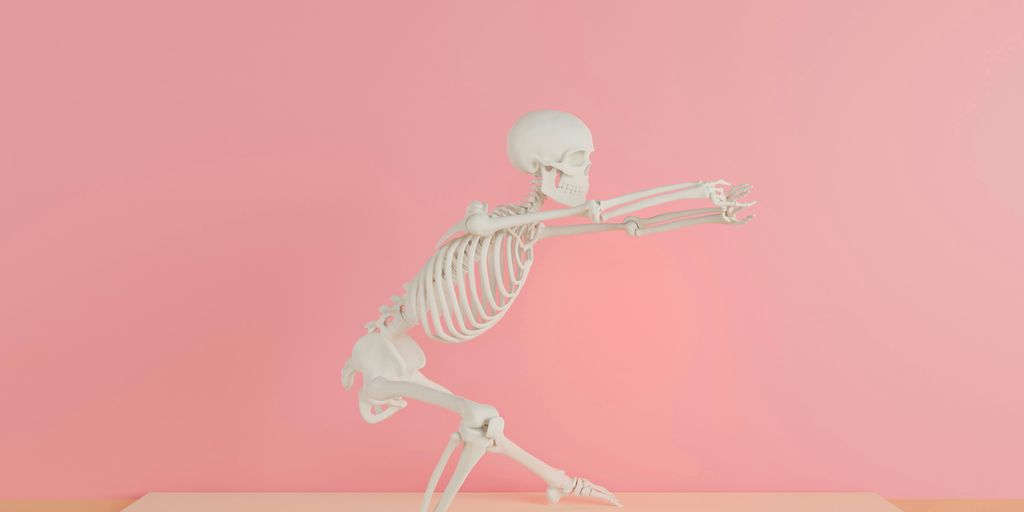 a skeleton is standing on one leg and pointing at something