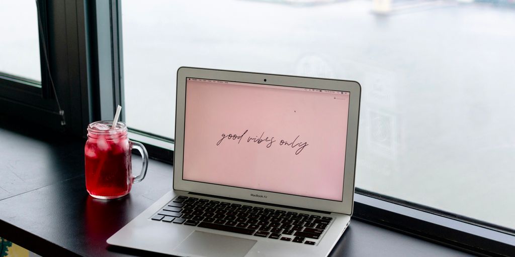 macbook air on black table