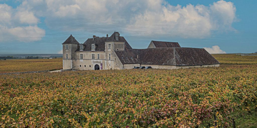 a large building sitting in the middle of a field