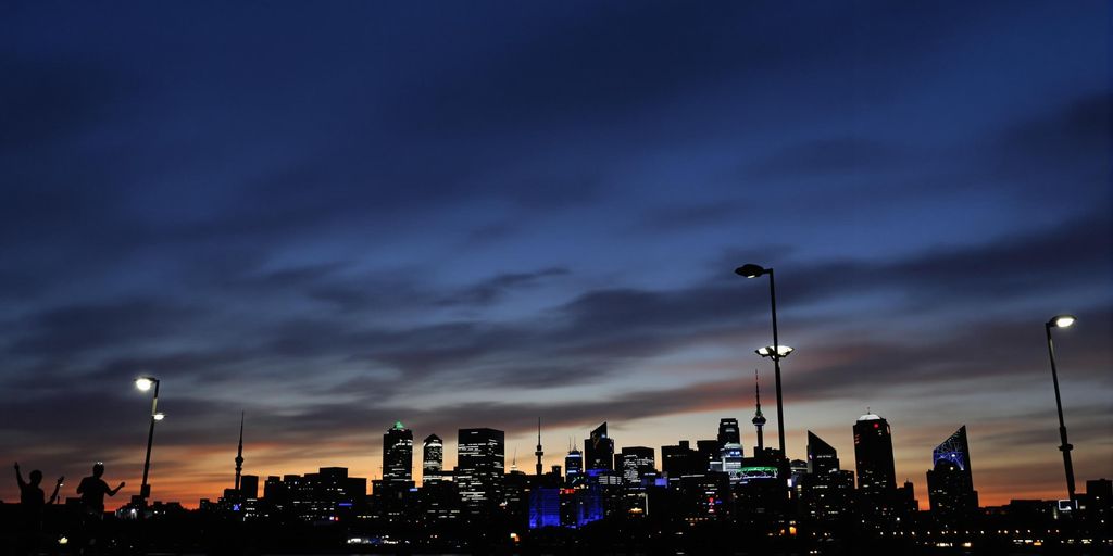 Modern city skyline with diverse individuals.
