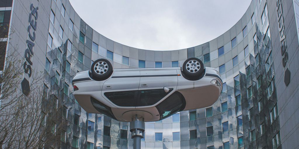 a futuristic car is in front of a building