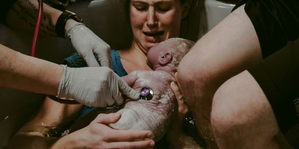 a person holding a baby