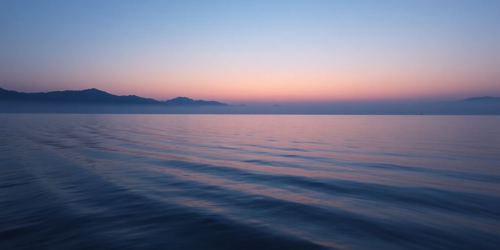 Serene landscape with calm waters and twilight sky.