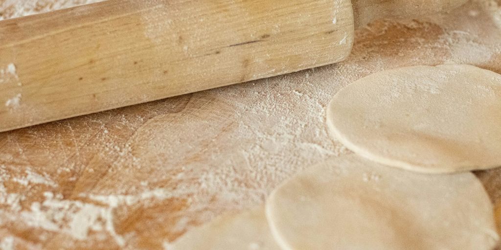 white round ornament on brown wooden surface