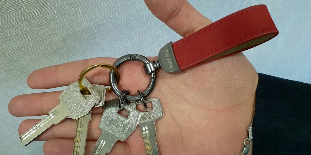 a person holding a bunch of keys in their hand