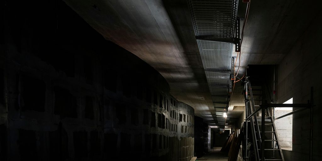 black and white tunnel with stairs