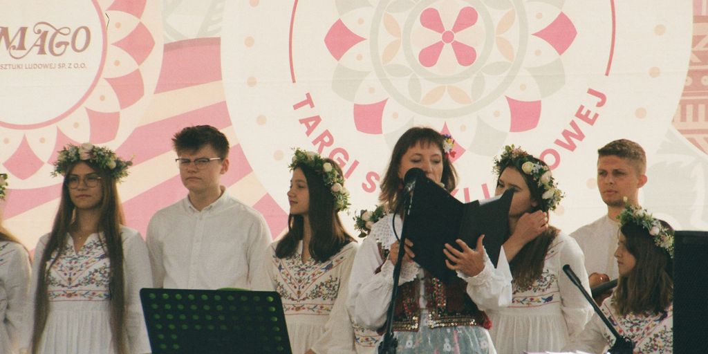 a group of people that are standing in front of a microphone