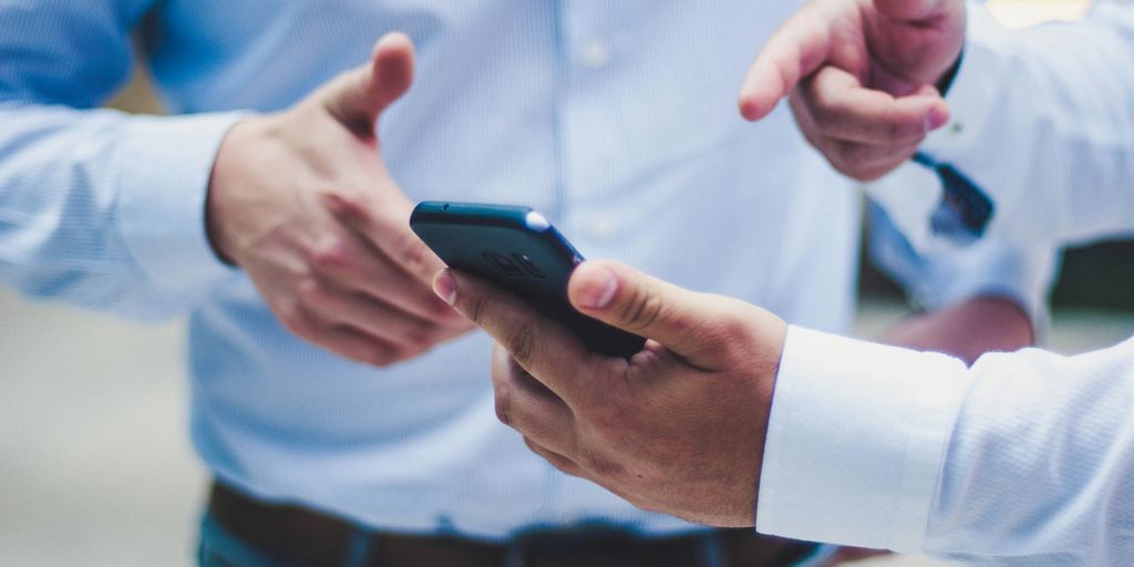 person holding black smartphone