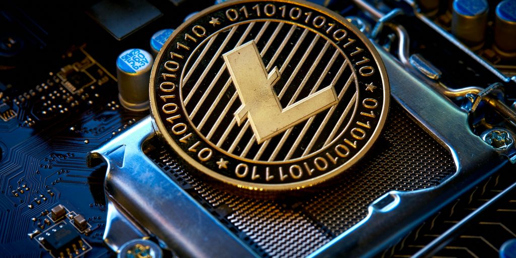 a close up of a computer chip with the letter l on it
