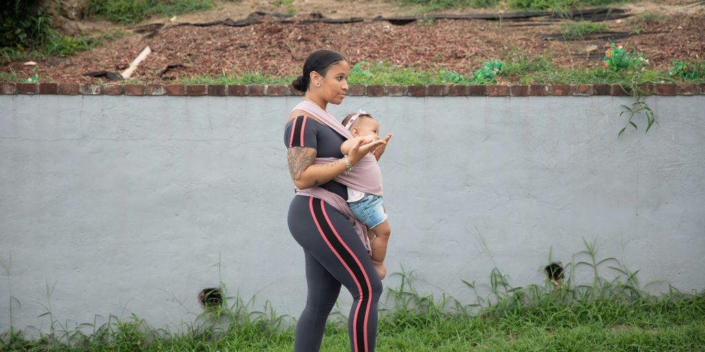 a person holding a baby
