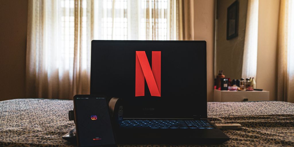 black laptop computer on table