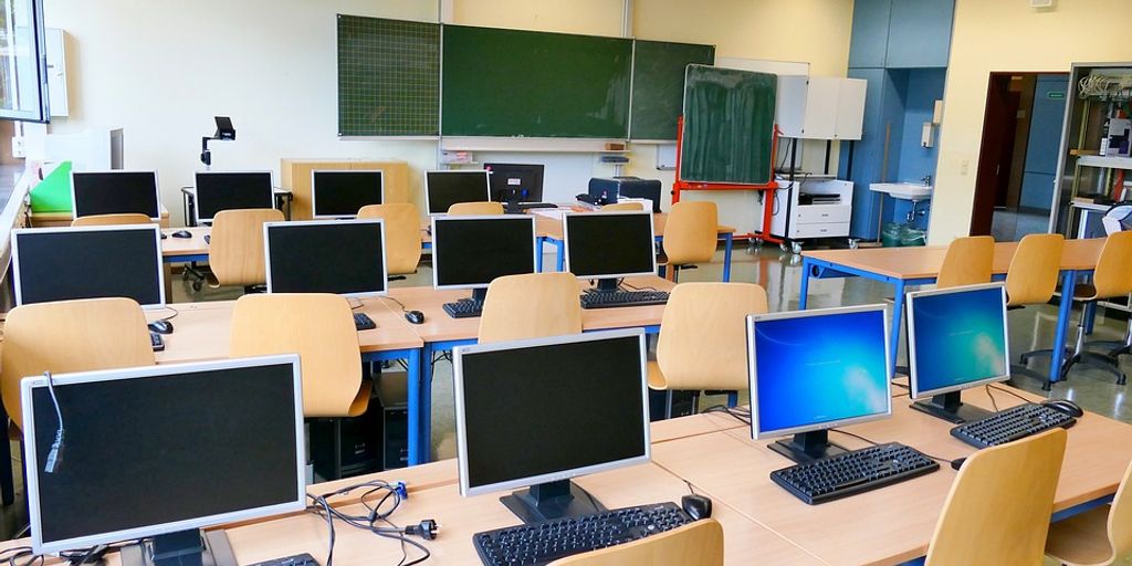 students using computers in a modern classroom
