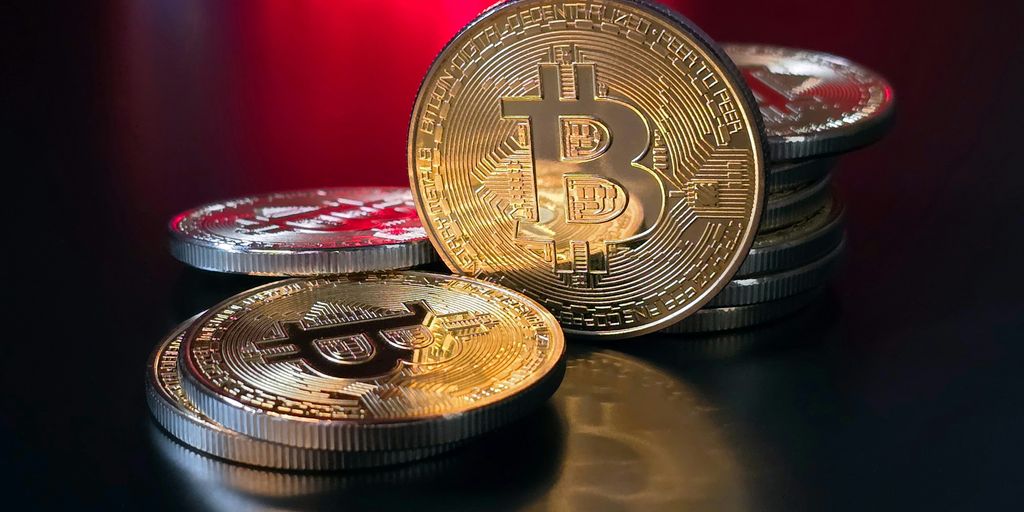 a pile of bitcoins sitting on top of a table