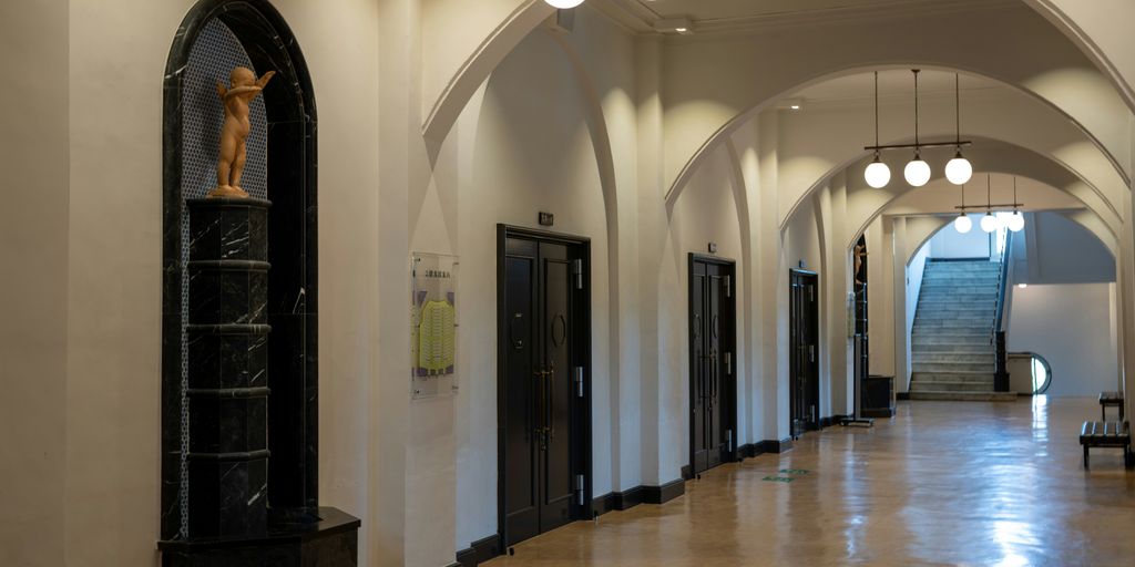 a long hallway with a clock on the wall