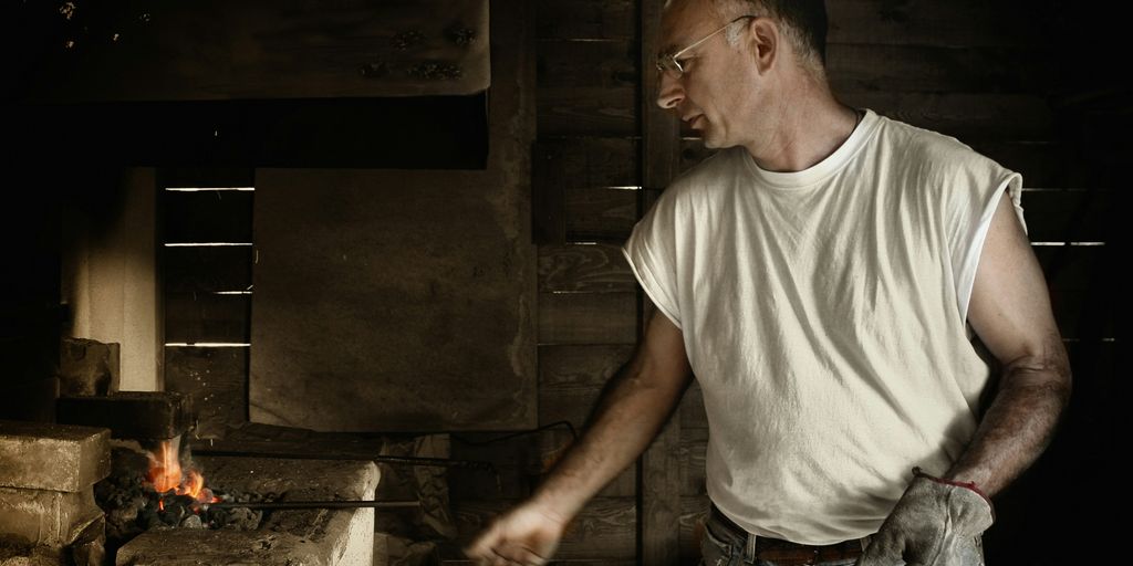 man standing near burner