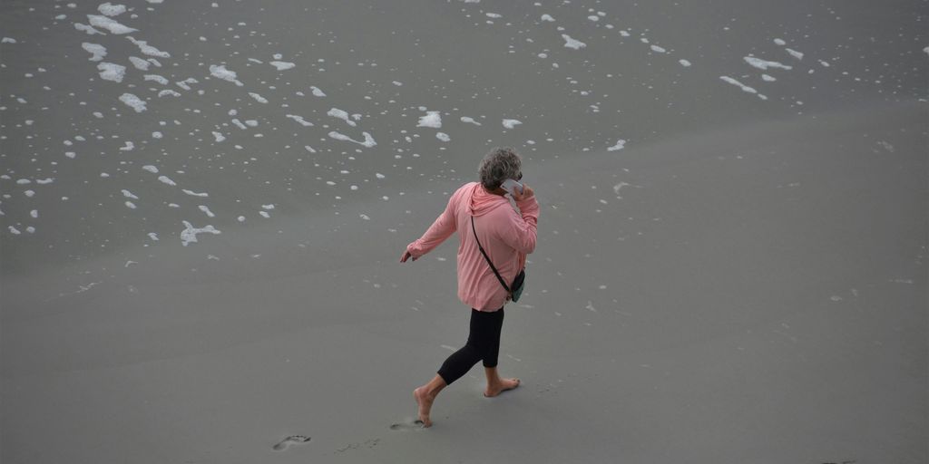 a person walking on a beach