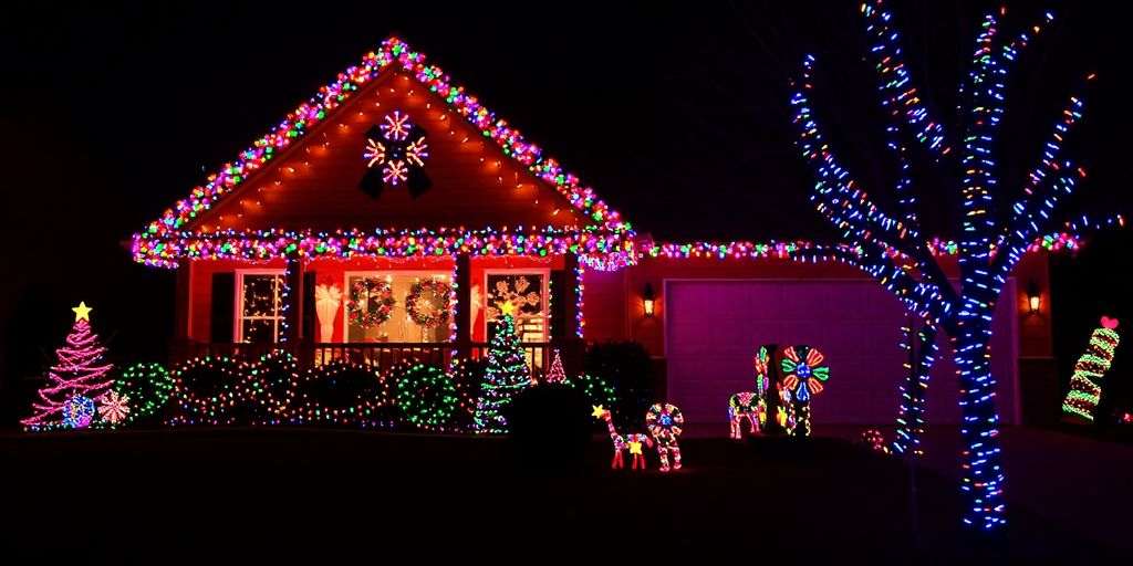 Festive house adorned with bright Christmas lights.