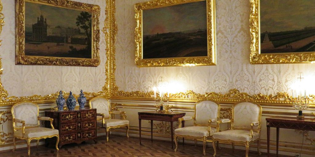 a room with a lot of paintings on the wall