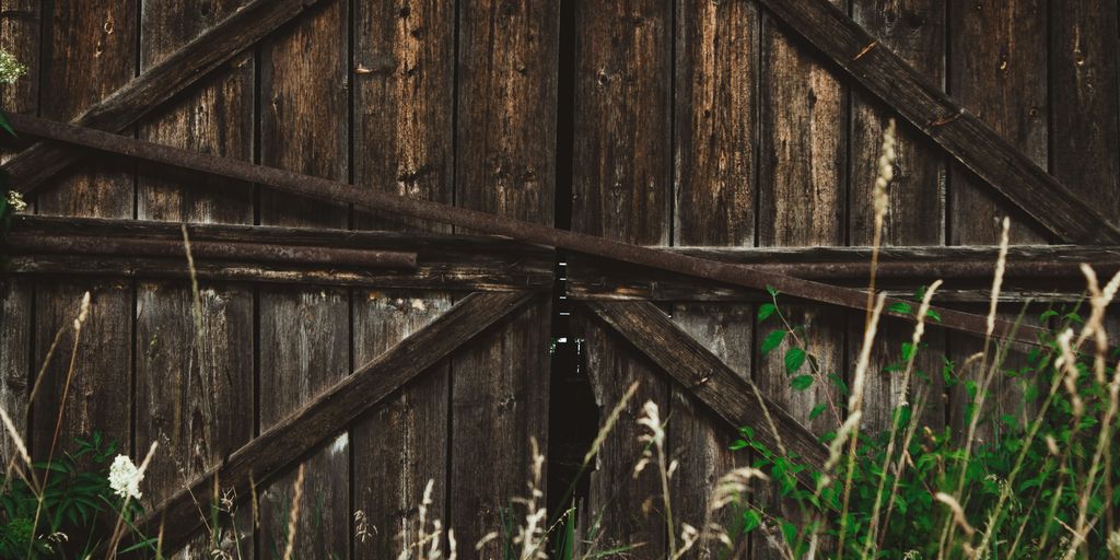 an old barn door with a wooden frame