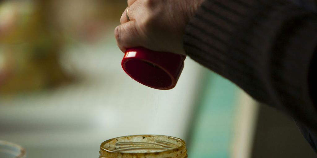 person holding red plastic cup